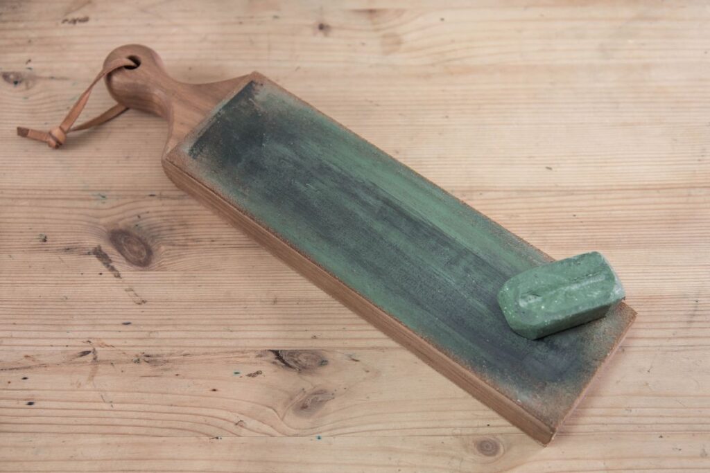 A leather strop with polishing compound