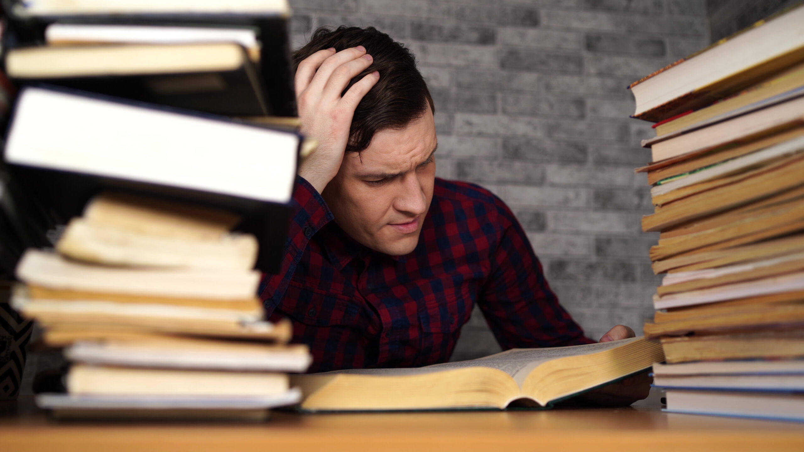 Man,Student,Boring,Reading,Book,At,Library,With,A,Lot