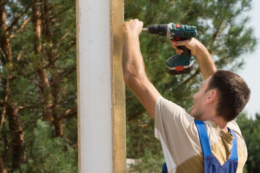 working with impact driver outdoors jobsite