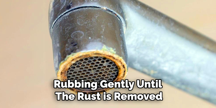 Rubbing Gently Until
The Rust is Removed