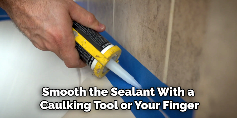 Smooth the Sealant With a
Caulking Tool or Your Finger