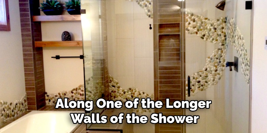 Along One of the Longer
Walls of the Shower