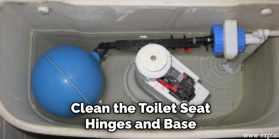 Clean the Toilet Seat Hinges and Base