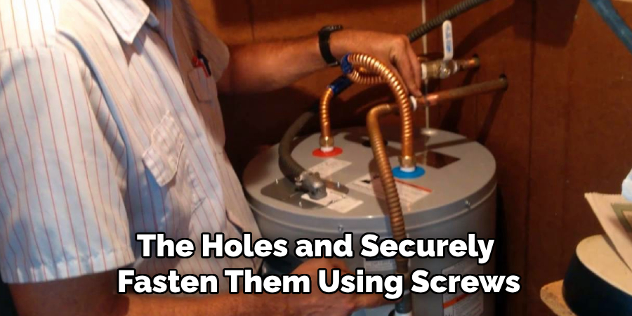 The Holes and Securely
Fasten Them Using Screws