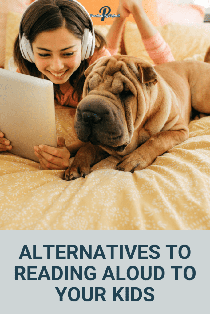 child reading and listening to audiobook with dog on the bed