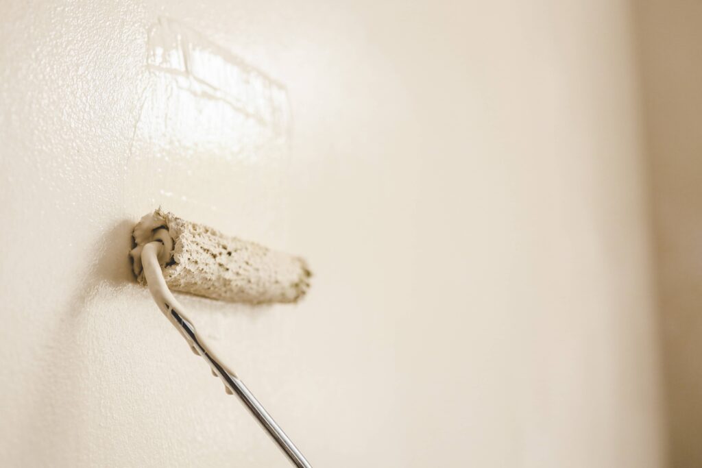 applying paint to walls