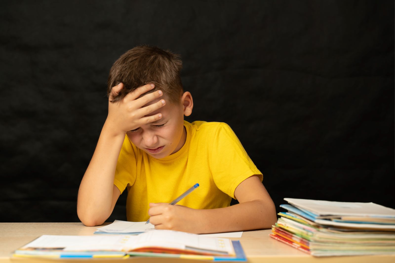 Boy Struggling To Study