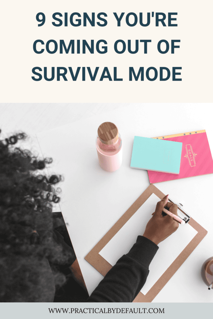woman writing on a sheet, signs you are coming out of survival mode