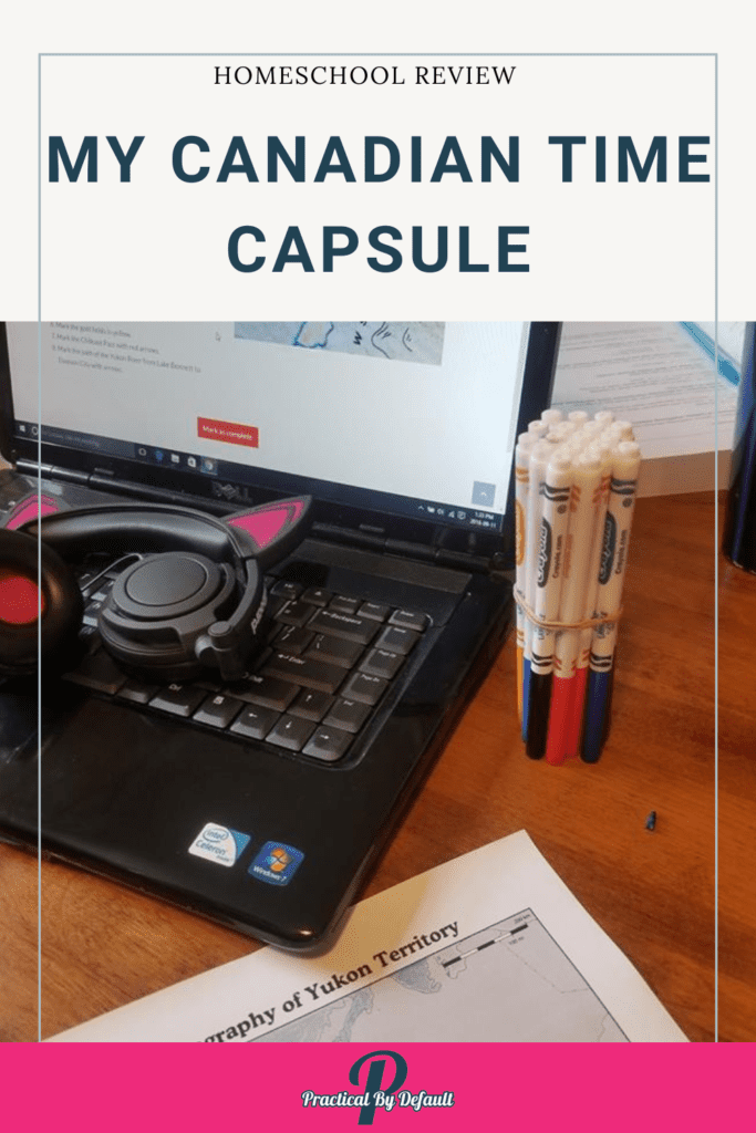 computer on a desk, with notebooking page. Homeschool course on screen my Canadian time capsule