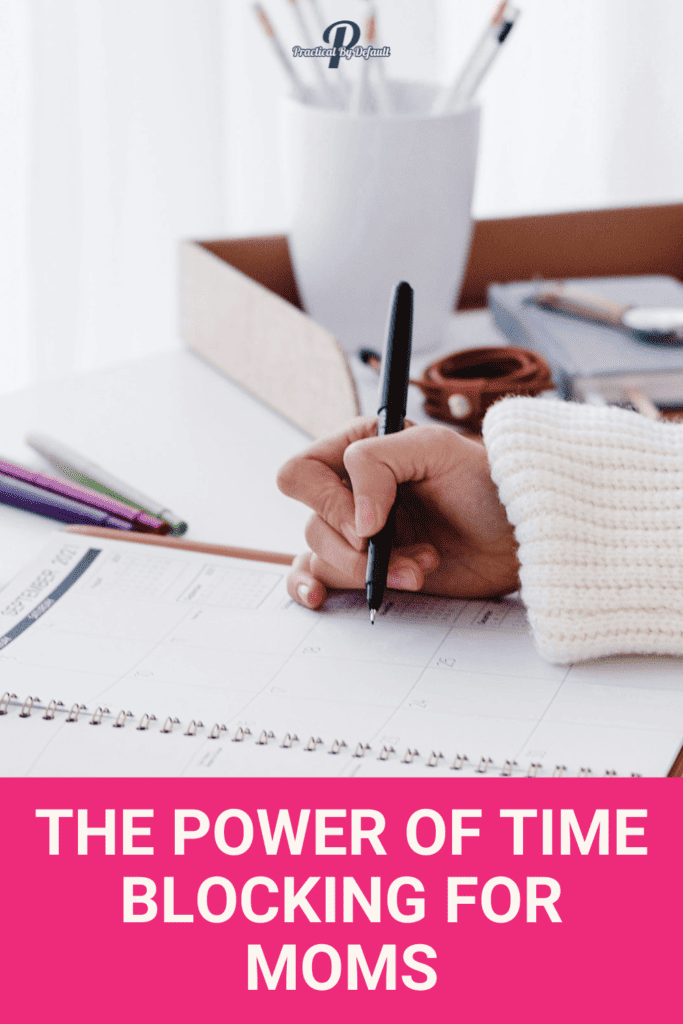 woman writing on a planner