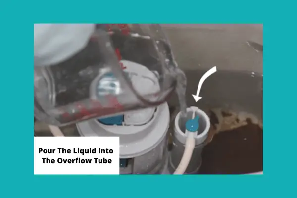 pour the liquid into the overflow tube