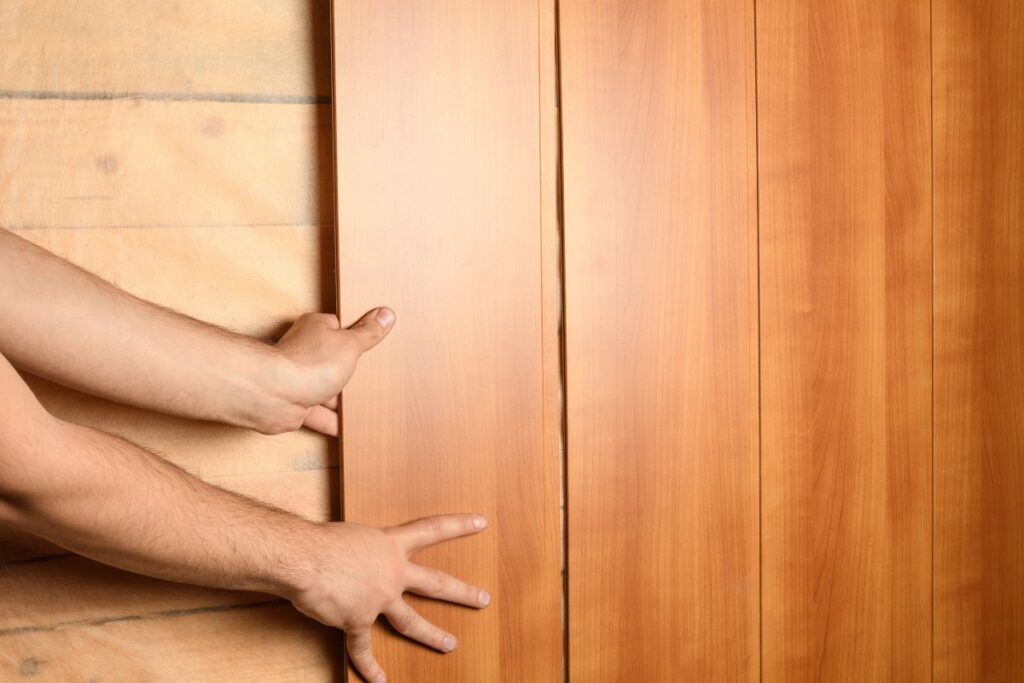 Installing wood panels on wall